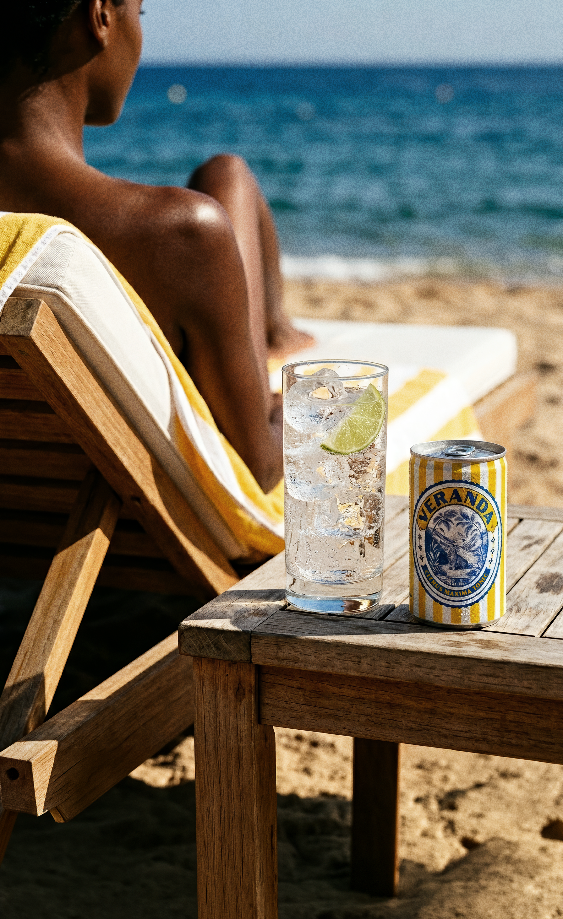 Woman relaxing on a sun lounger with Verandah Tonic